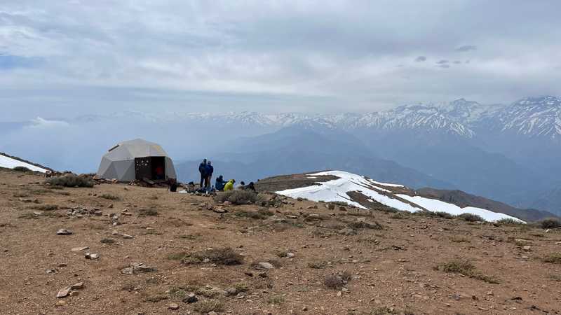 Hikers rest at the summit of Cerro Provincia, near Santiago, Chile